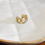 Anel de Aço Círculos Dourados