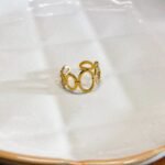 Anel de Aço Círculos Dourados